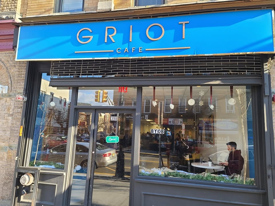 Griot Cafe logo